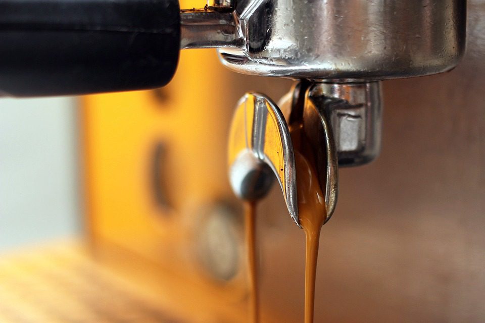 Espresso being poured from a machine