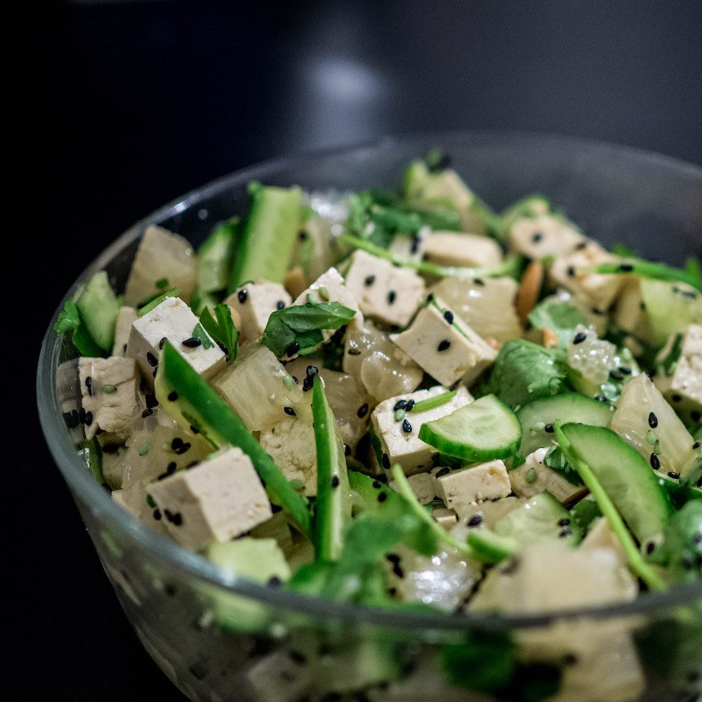 white tofu in bowl with green salad