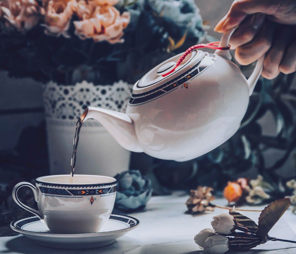 tea being poured from a teapot