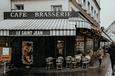 A café brasserie shopfront in Paris named Le Saint Jean