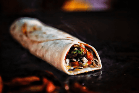 A burrito with vegetable filling