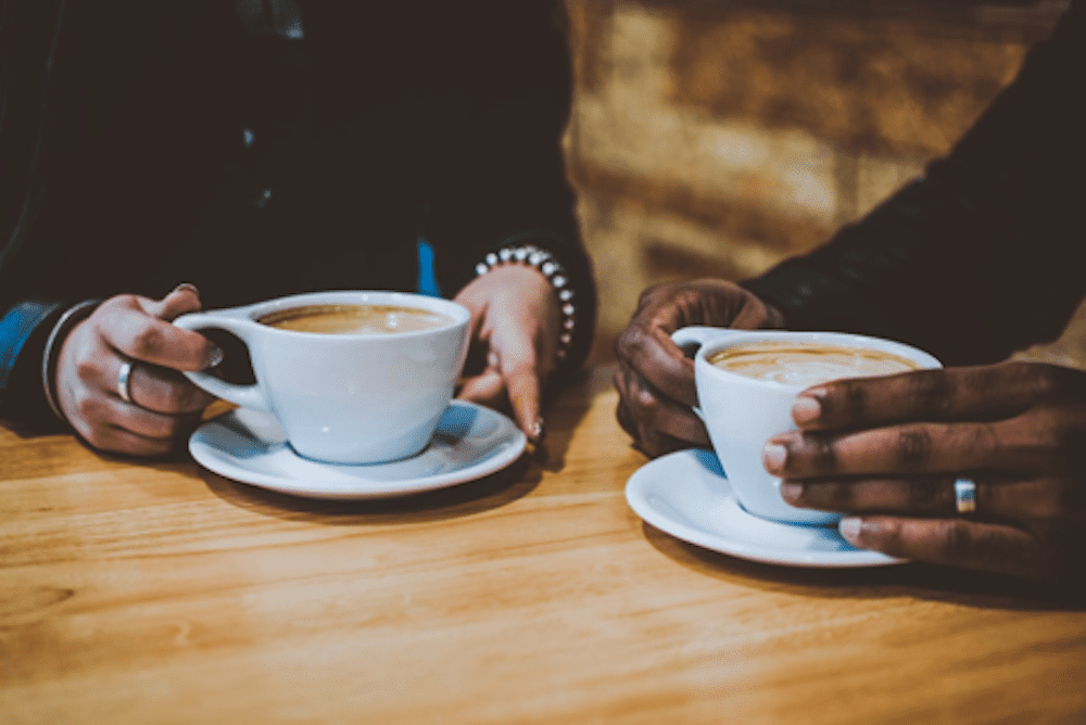 Two people have a meeting and drinking coffee