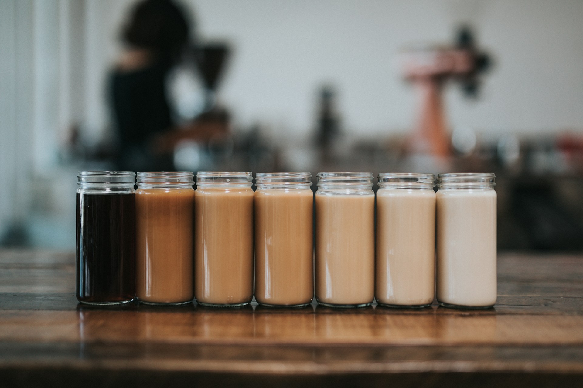 Different glasses of coffee with various milk content