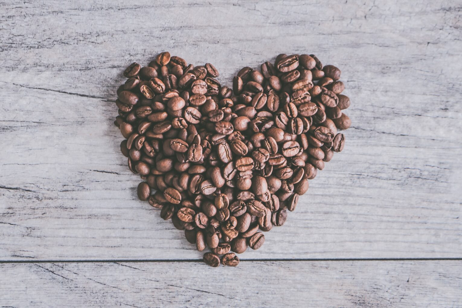coffee beans in the shape of a heart
