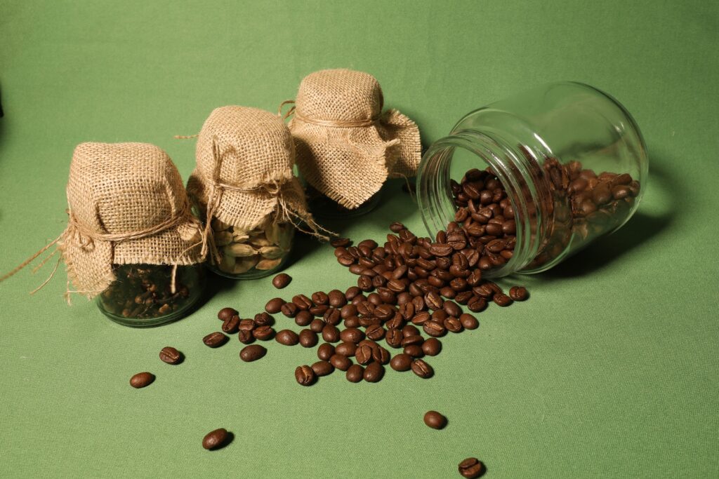 Coffee beans spilling out of container