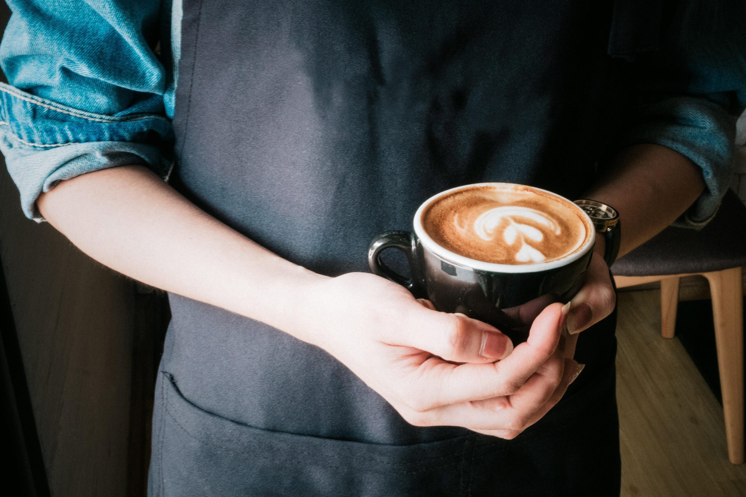 barista holding a cup