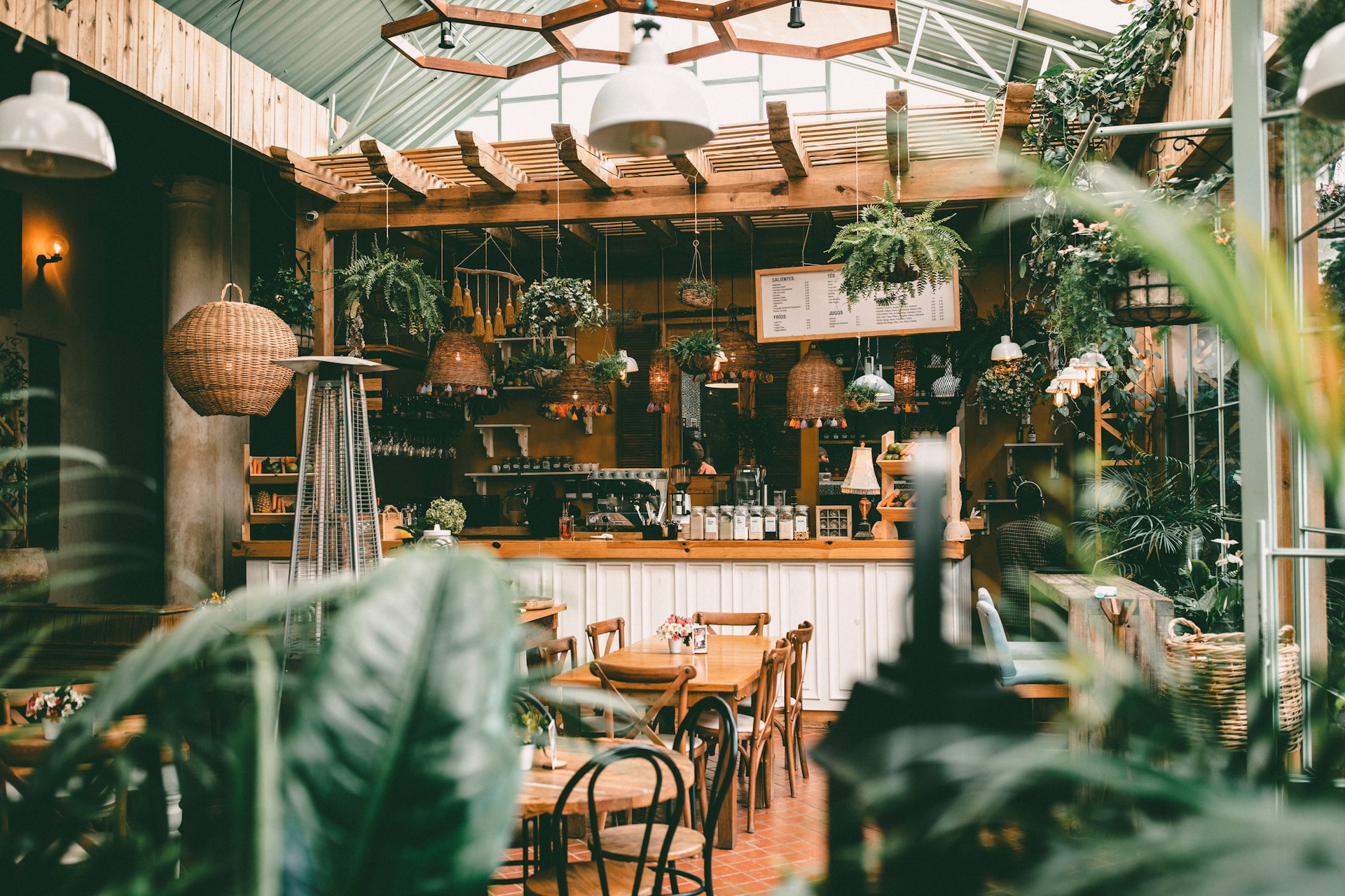 Coffee shop decorated in a boho style with lots of plants