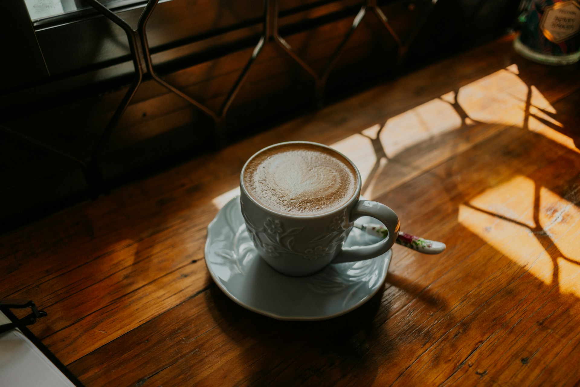 a coffee cup with flower design