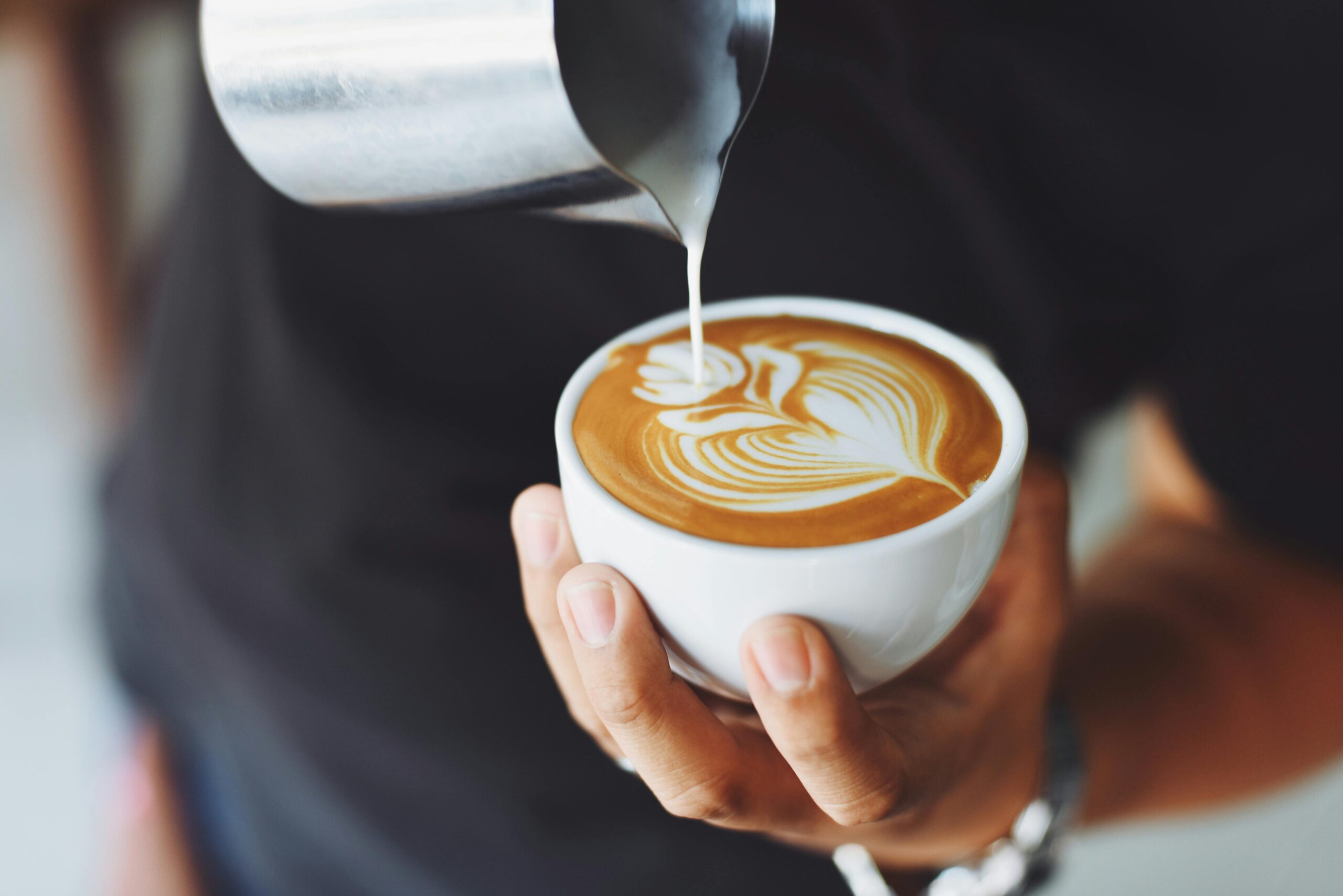 Barista pouring latte art