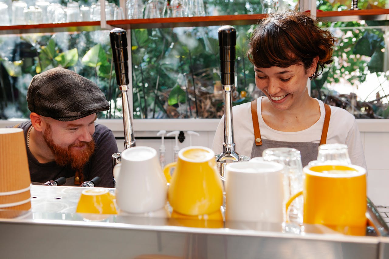 Baristas at a coffee machine 