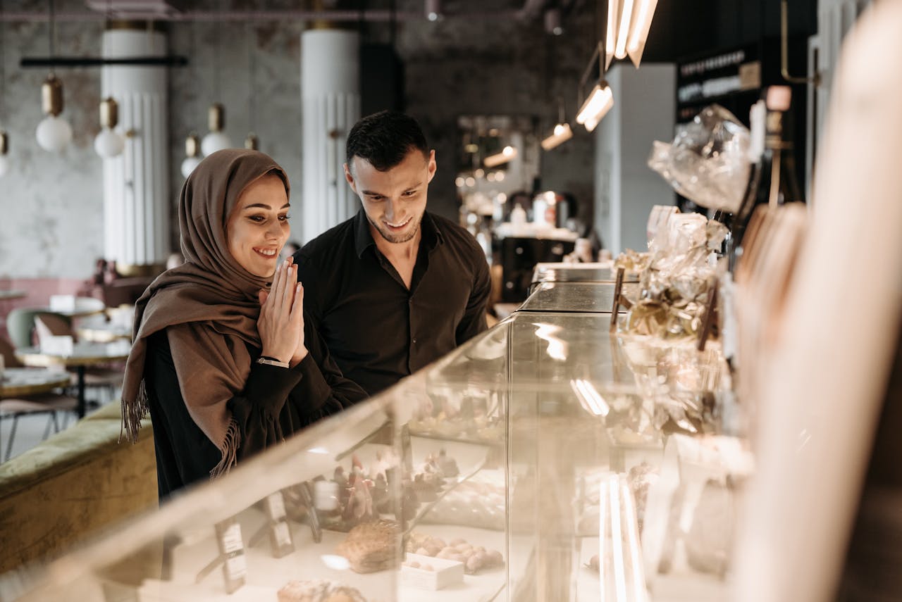 Two customers looking at products in a coffee shop
