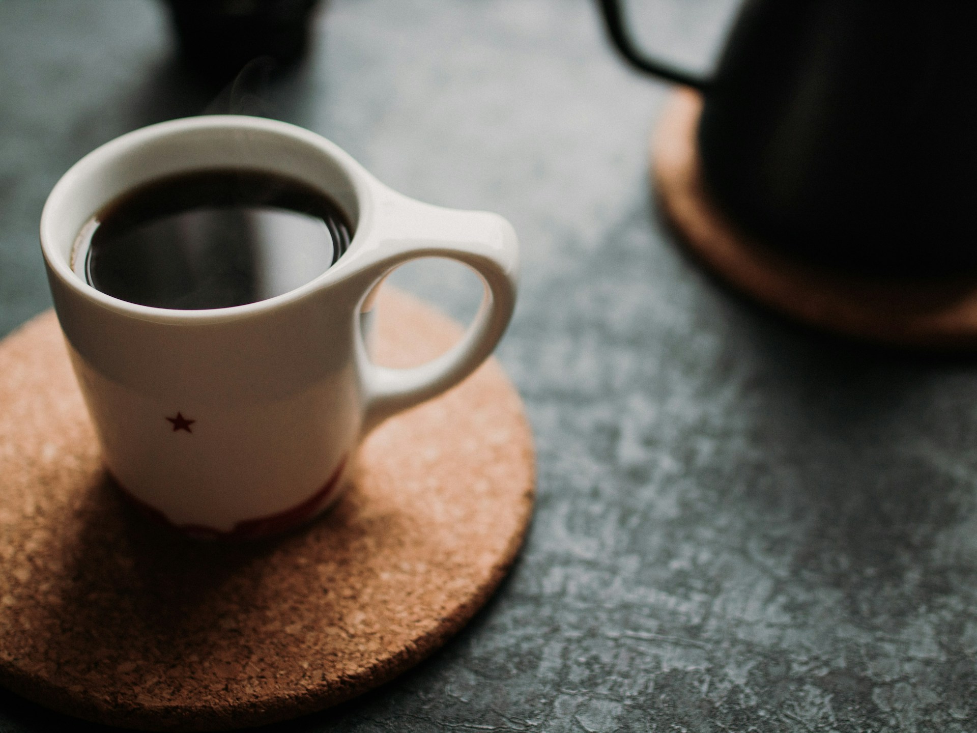 Black coffee in a small white cup