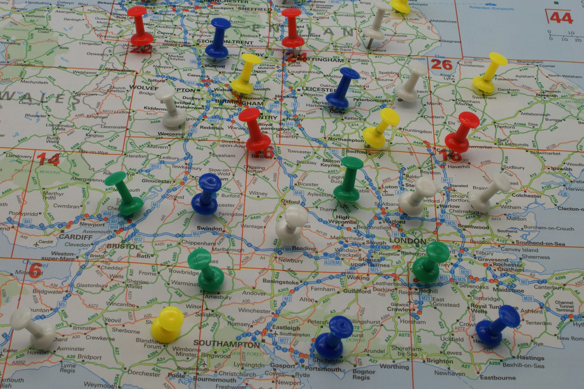 Various colourful pins in a map of the UK