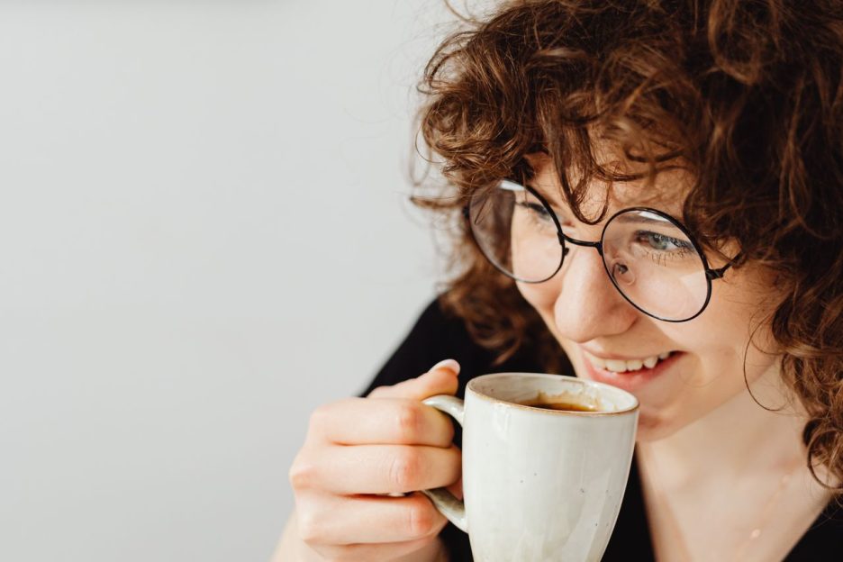 A woman enjoying a cup of coffee 